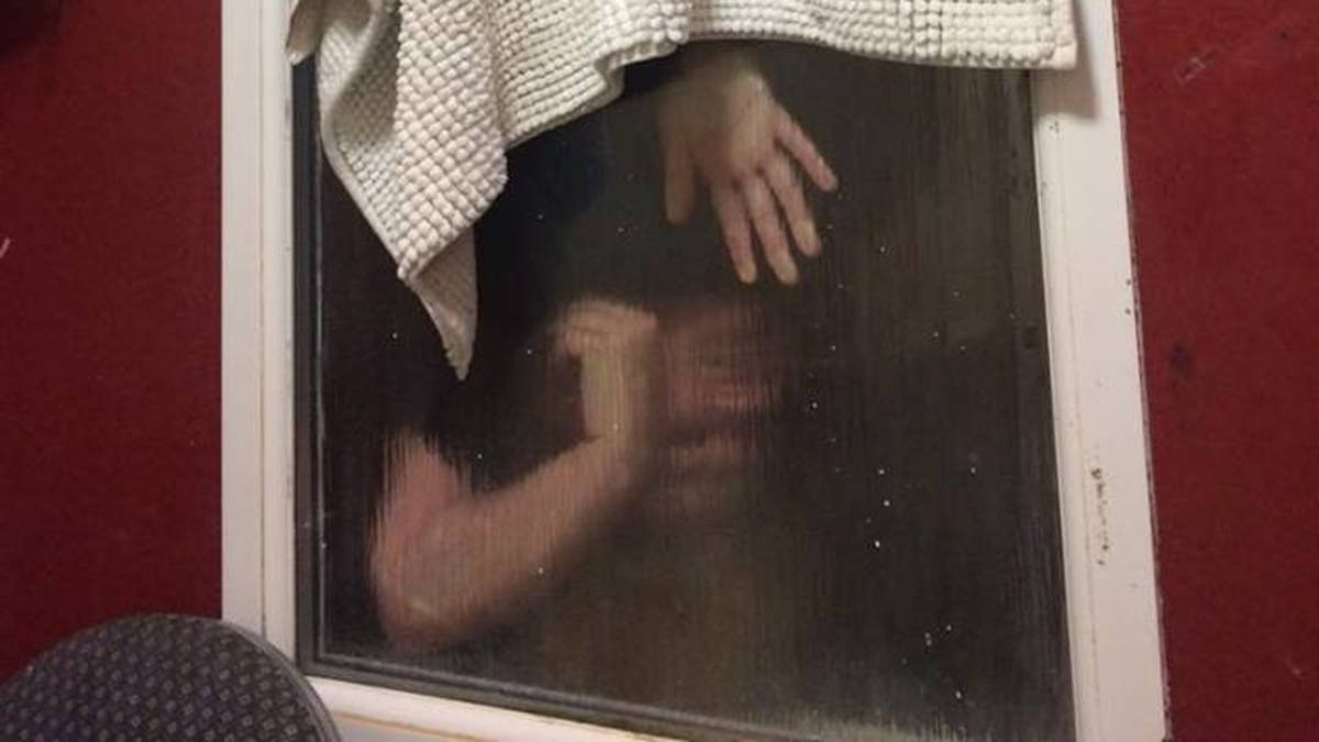 lady gets stuck in window dress falls down Untold story behind viral window-flash video