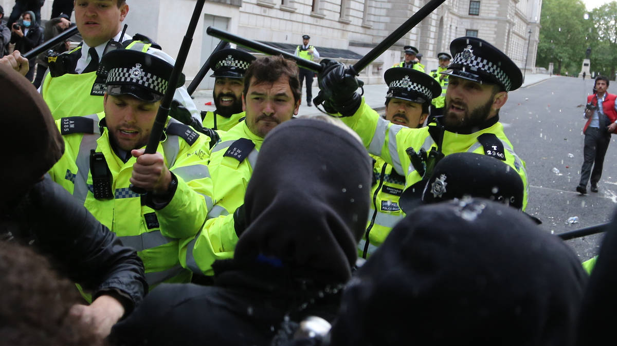 Twelve arrested at protest after violent clashes leave eight police ...