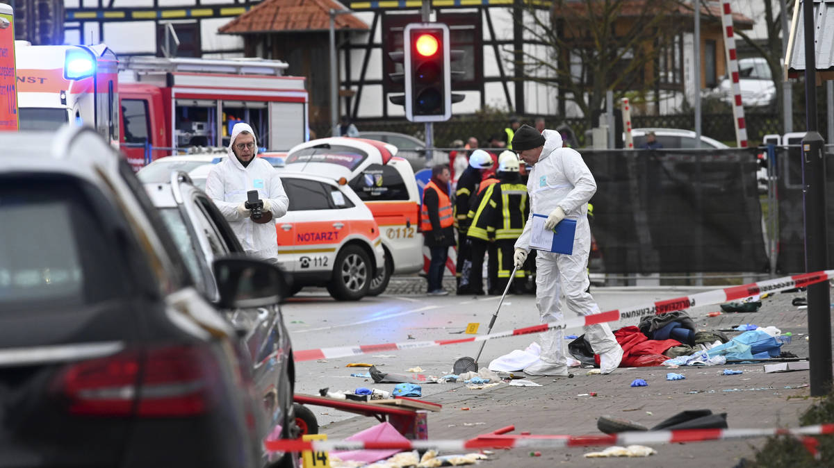Man charged with attempted murder after car driven into crowd at ...