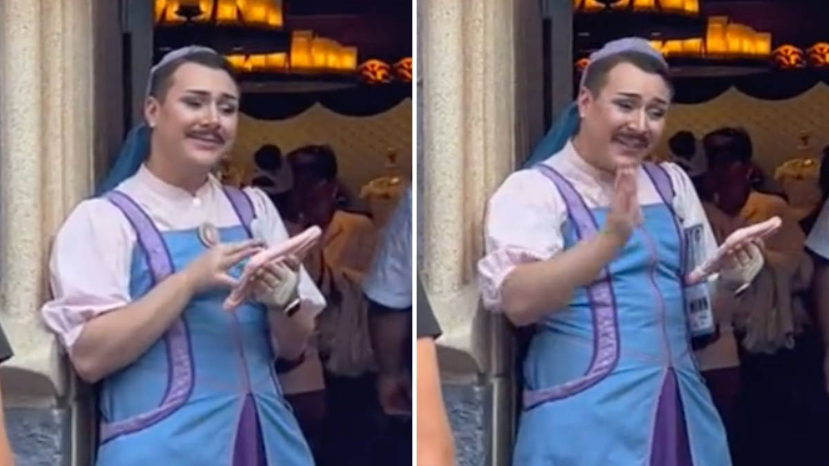 male disney employee dressed as fairy godmother Fury as male Disneyland employee appears as Fairy Godmother's apprentice at  Bibbidi Bobbidi Boutique