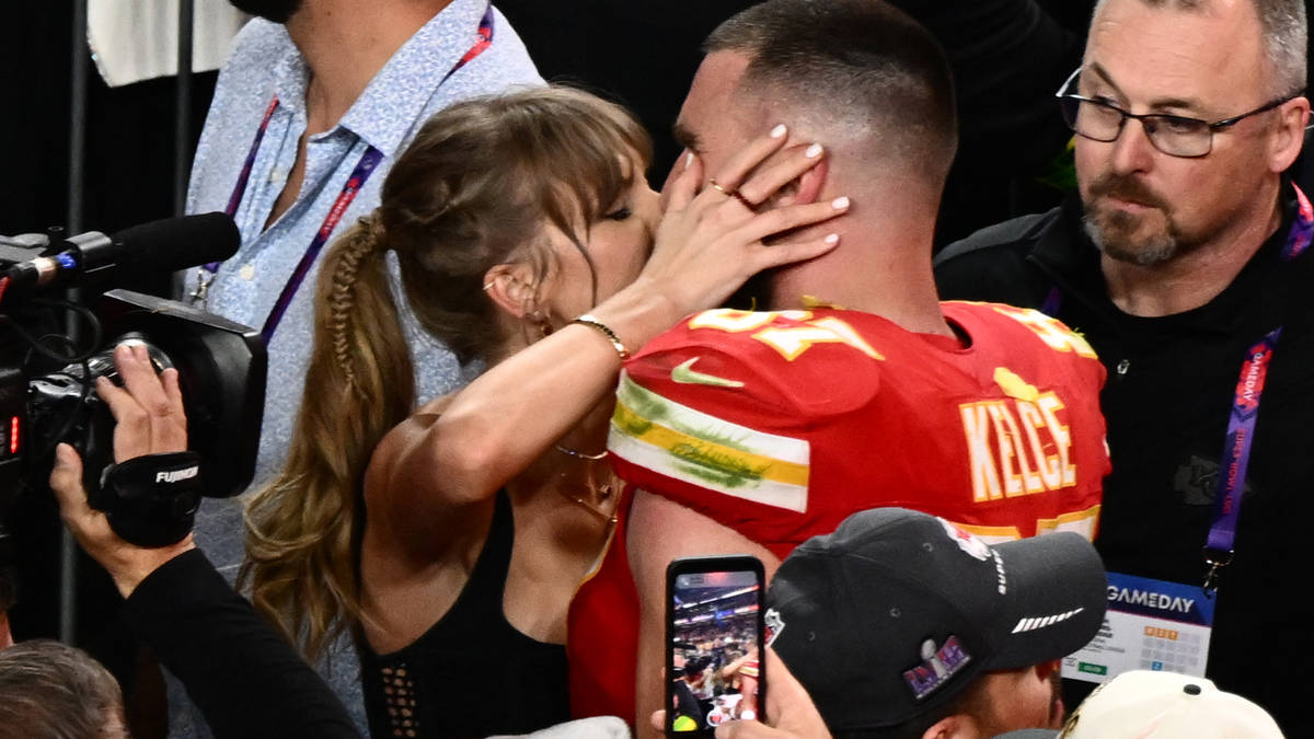 Sealed with a kiss: Taylor Swift and Travis Kelce celebrate on field ...