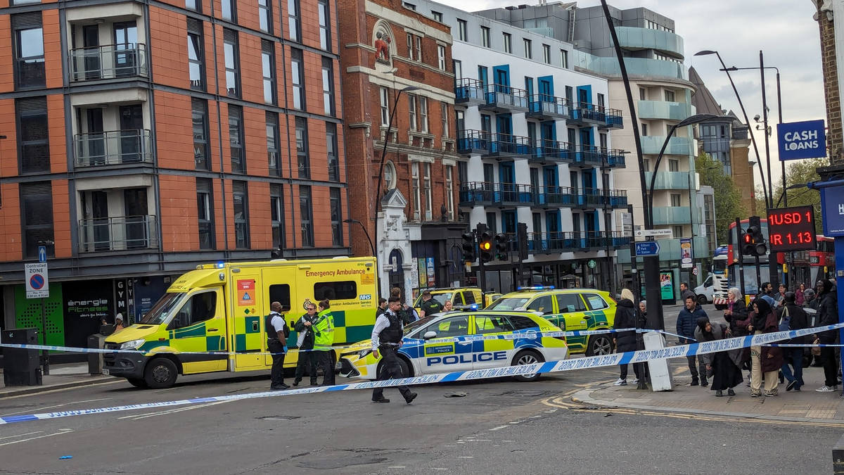 Arrest after man and woman injured in stabbing on busy London street | LBC