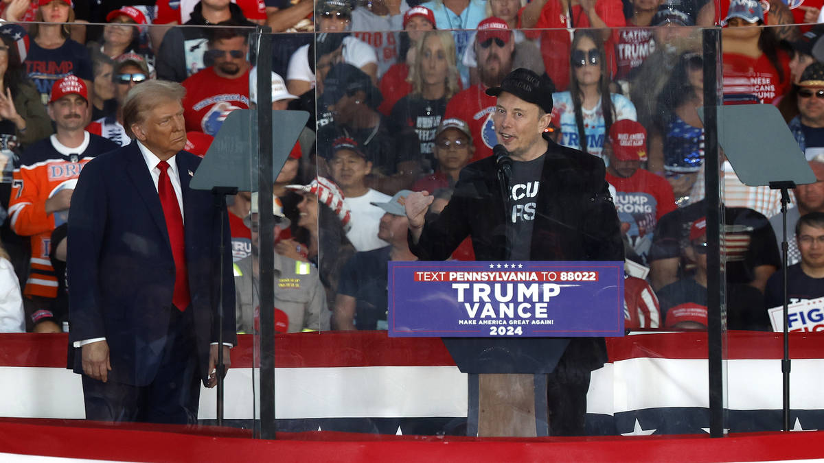 Elon Musk joins Donald Trump on stage as he holds rally at site of ...