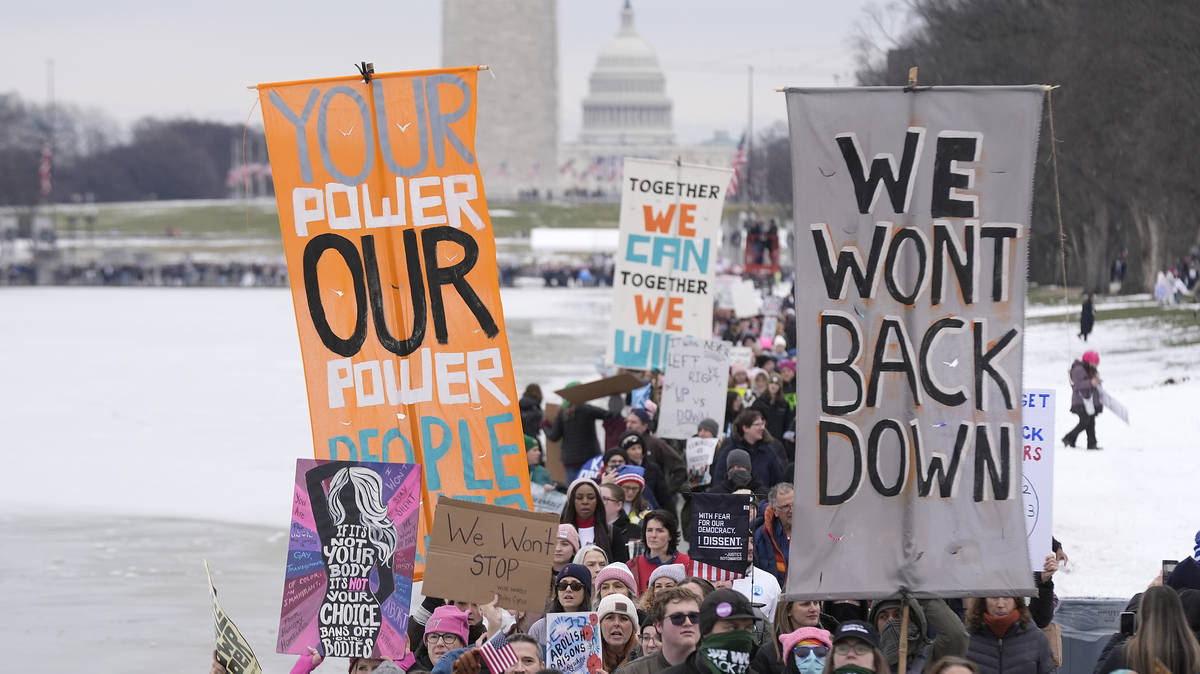 Thousands flock to Washington DC 'People's March' in protest ahead of ...