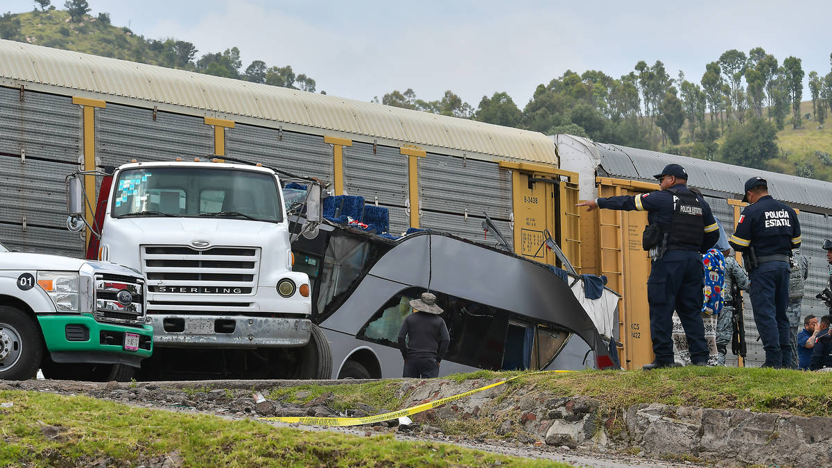 At least 10 dead and 41 injured after freight train crashes into double ...