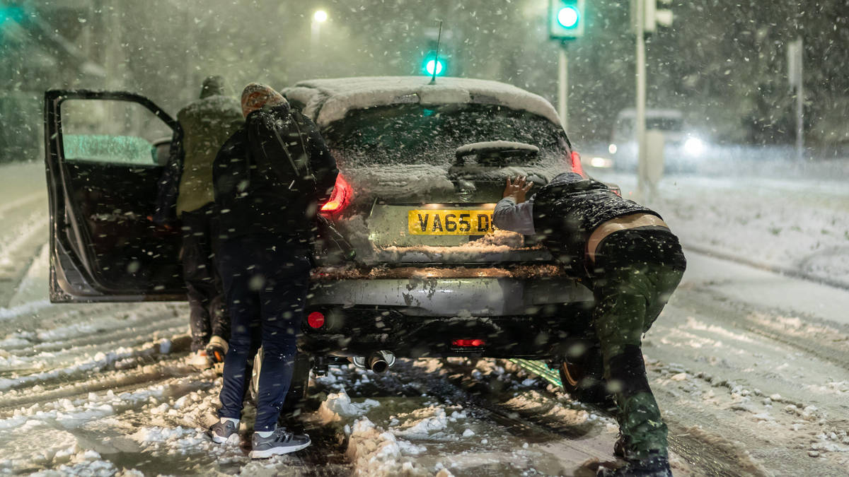 Tens of thousands still without power as snow and ice warnings in place across UK