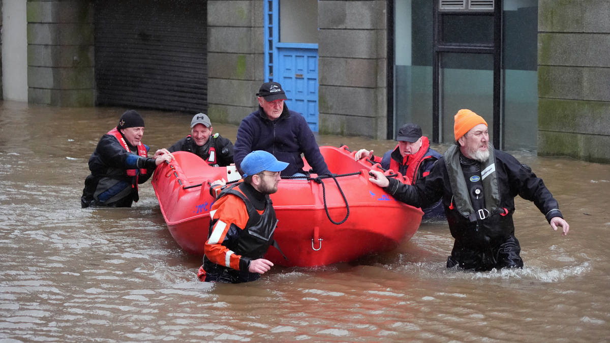 People rescued from cars, schools shut and flights cancelled in Storm ...