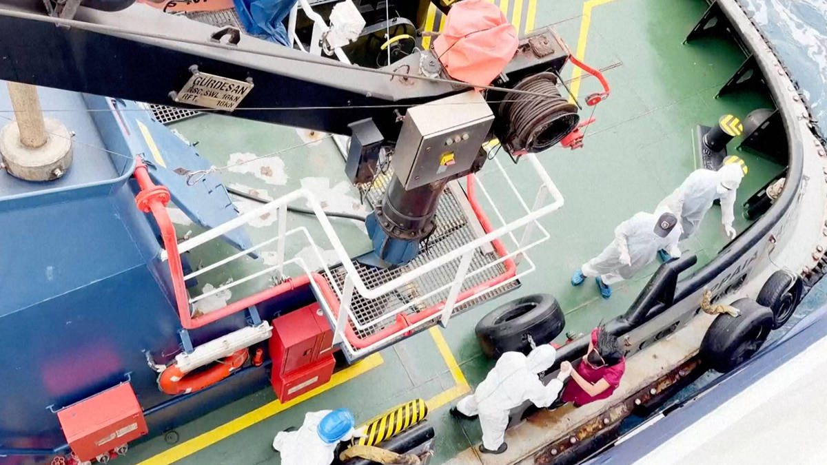 Trapped on the death cruise ship: Medics in hazmat suits board stricken vessel as virus outbreak 'spreads between passengers'