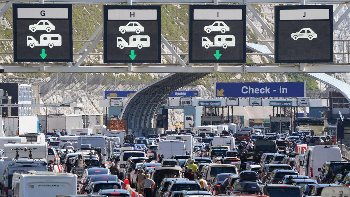 French authorities 'suspend new EU border checks' as holidaymakers at Dover face three-hour delays in 30C heat
