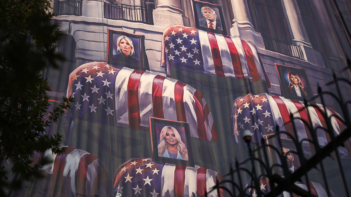 Mural showing Trump family with flag-draped coffins displayed in Tehran in chilling warning to US