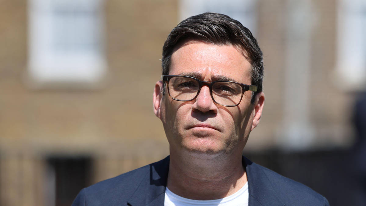 Where is Andy Burnham on holiday and who is in charge while he is away?