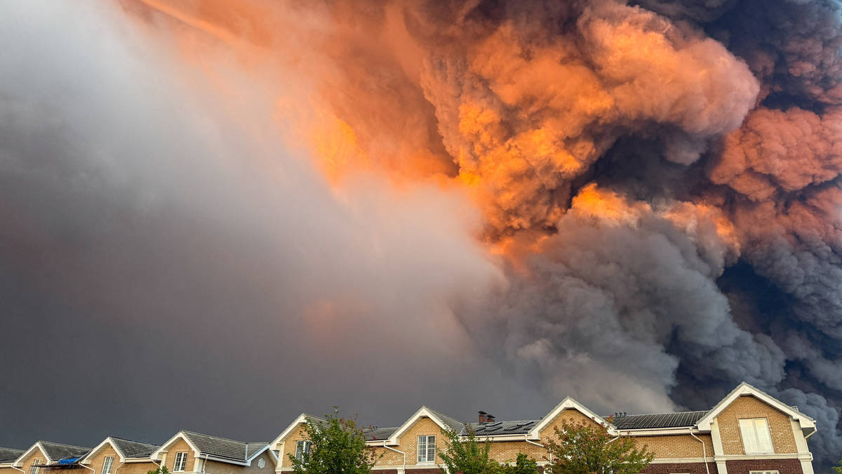 Moment huge fire engulfs Russian retail warehouse which left seven dead in Ukraine aerial attack