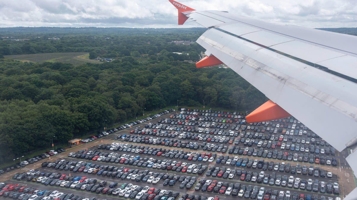 Man, 67, arrested and bailed after more than 100 cars were set on fire in suspected arson attack near Gatwick Airport